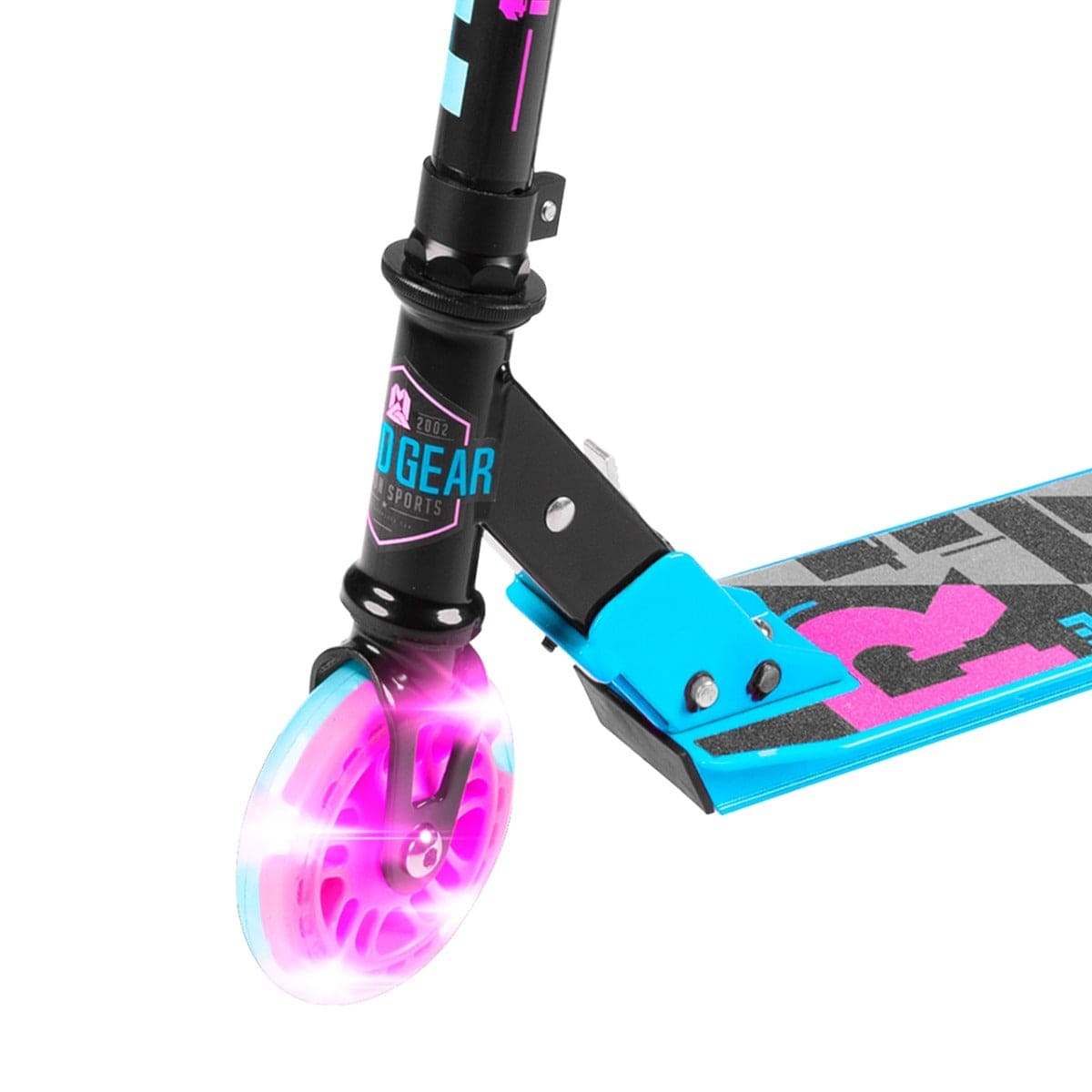 Close-up of the Madd Gear (MGP) Carve Rize Foldable Light Up Kick Scooter - Dreams, highlighting its front wheel and part of the deck. The wheel illuminates in pink and blue, complementing its sleek black and blue design with stylish branding elements.