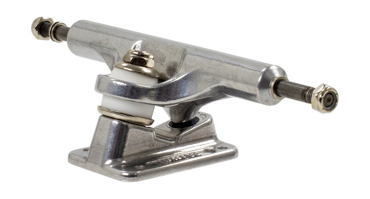 A detailed view of a Mindless Gen X Raw Longboard Truck, featuring a gleaming silver finish. Perfect for wider decks, this Standard King Pin truck highlights a visible kingpin, bushings, and extending axles secured with nuts on each side. The baseplate prominently displays the Mindless brand name beneath it.