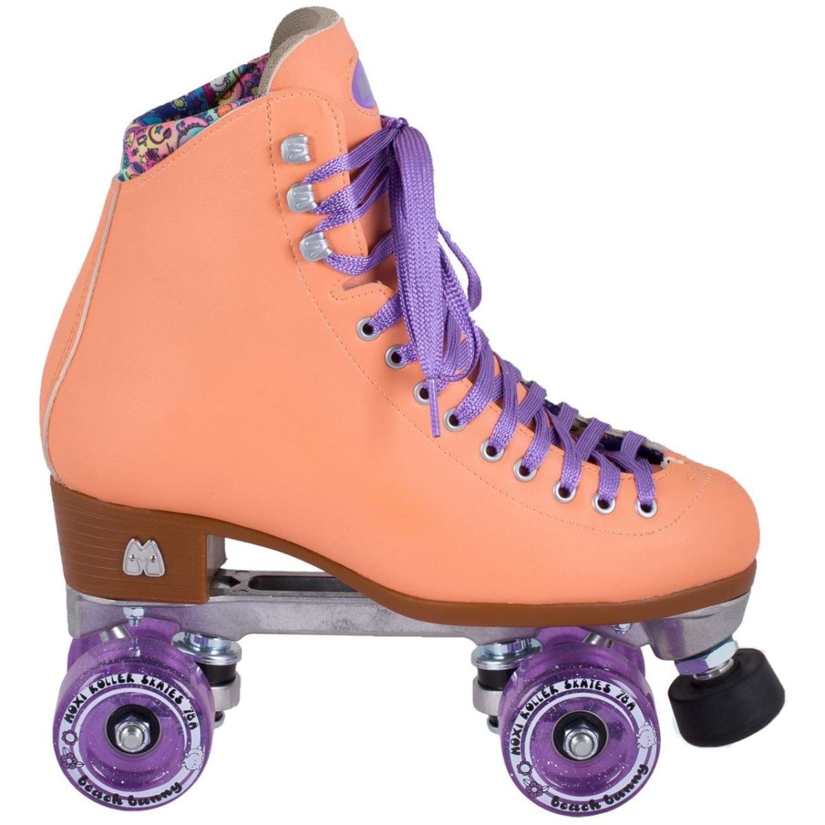 Introducing the Moxi Beach Bunny Quad Roller Skates in a charming peach color from Moxi. These animal-friendly skates feature eye-catching purple laces and wheels. The boot is adorned with decorative stitching and showcases a patterned interior lining, reminiscent of the popular Beach Bunny series by Moxi Skates. Complemented by a brown sole and durable metal base, these skates deliver exceptional style and durability on four wheels.