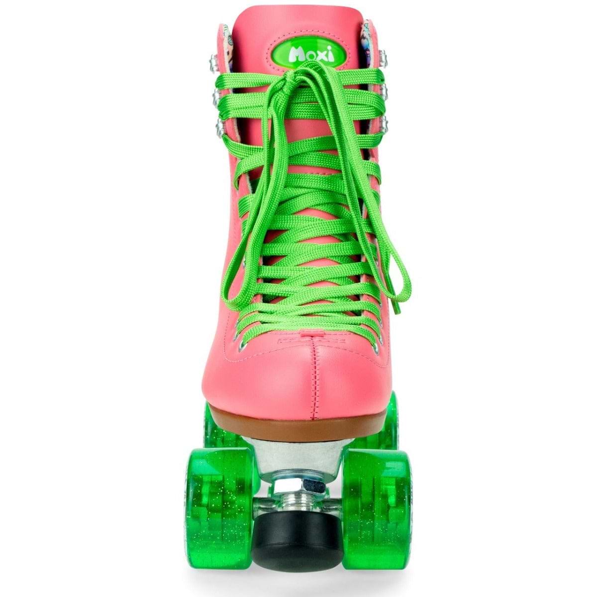 A bright pink Moxi Beach Bunny Quad Roller Skate in the Watermelon design is showcased from the front, featuring a high-top boot, green laces, and green wheels. The Beach Bunny logo is prominently displayed on the skate's tongue.