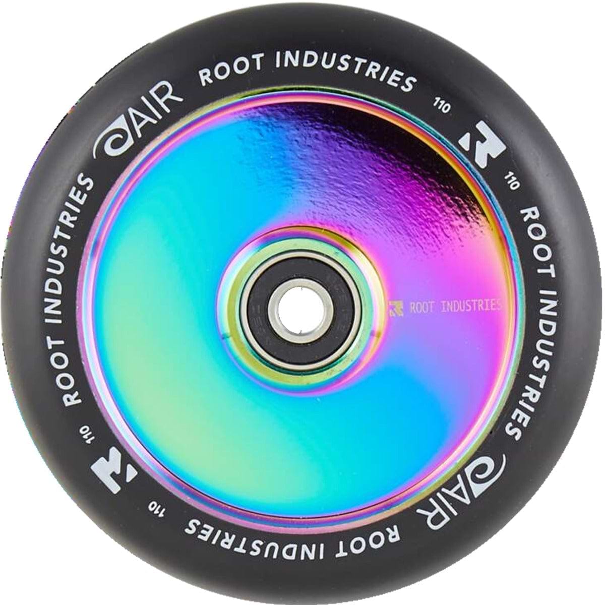 The Root Industries AIR Hollowcore 110mm Stunt Scooter Wheel in Black/Rocket Fuel Neochrome showcases a rainbow-hued core with a reflective finish, adorned with the brand's logo around the rim. This lightweight wheel features a black tire, engineered for superior performance and style.
