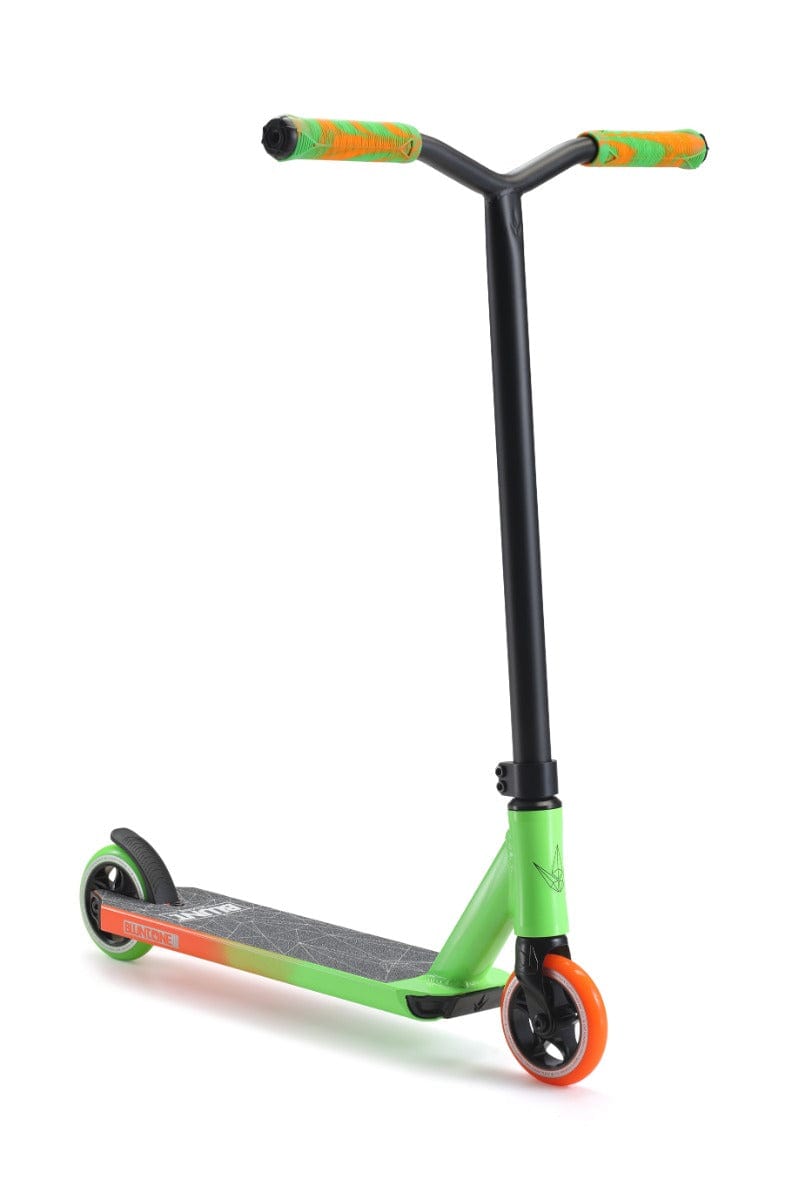 Introducing the Blunt Envy ONE S3 Complete Stunt Scooter in Green/Orange. This vibrant scooter showcases a green deck with orange accents, complemented by its two wheels and black handlebars fitted with orange grips. The sturdy black frame makes it perfect for executing stunts and tricks, catering to both beginner riders eager to master their skills and those in search of pro scooter parts.
