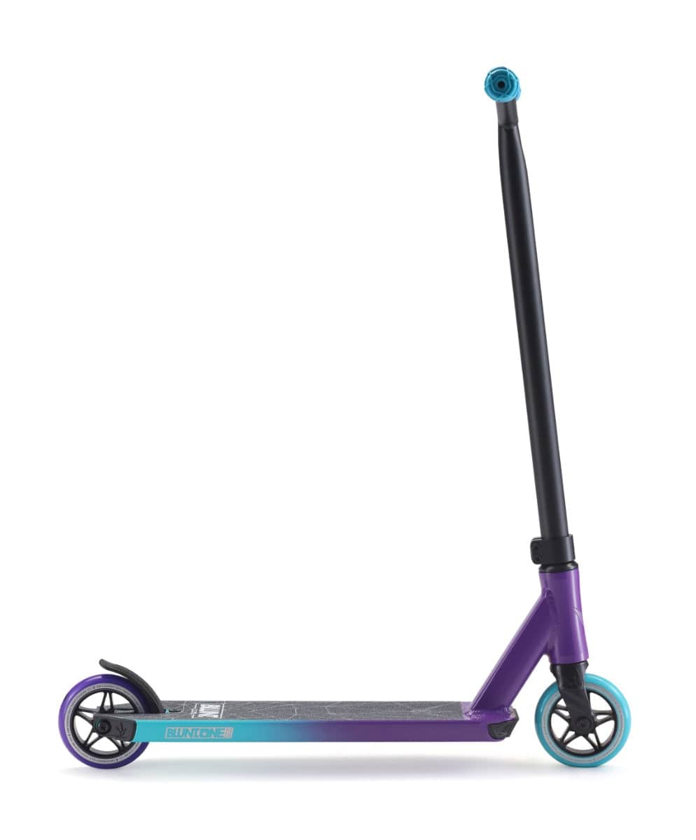 Introducing the Blunt Envy ONE S3 Complete Stunt Scooter in Purple and Teal. This vibrant scooter showcases a durable design with pro parts, including two wheels, a sturdy black handlebar, and a sleek deck. The rear wheel features an eye-catching teal color, while the front wheel sports a black finish with a teal rim. Additionally, the handle is accented by a distinctive blue cap. Ideal for both beginners and experienced riders!