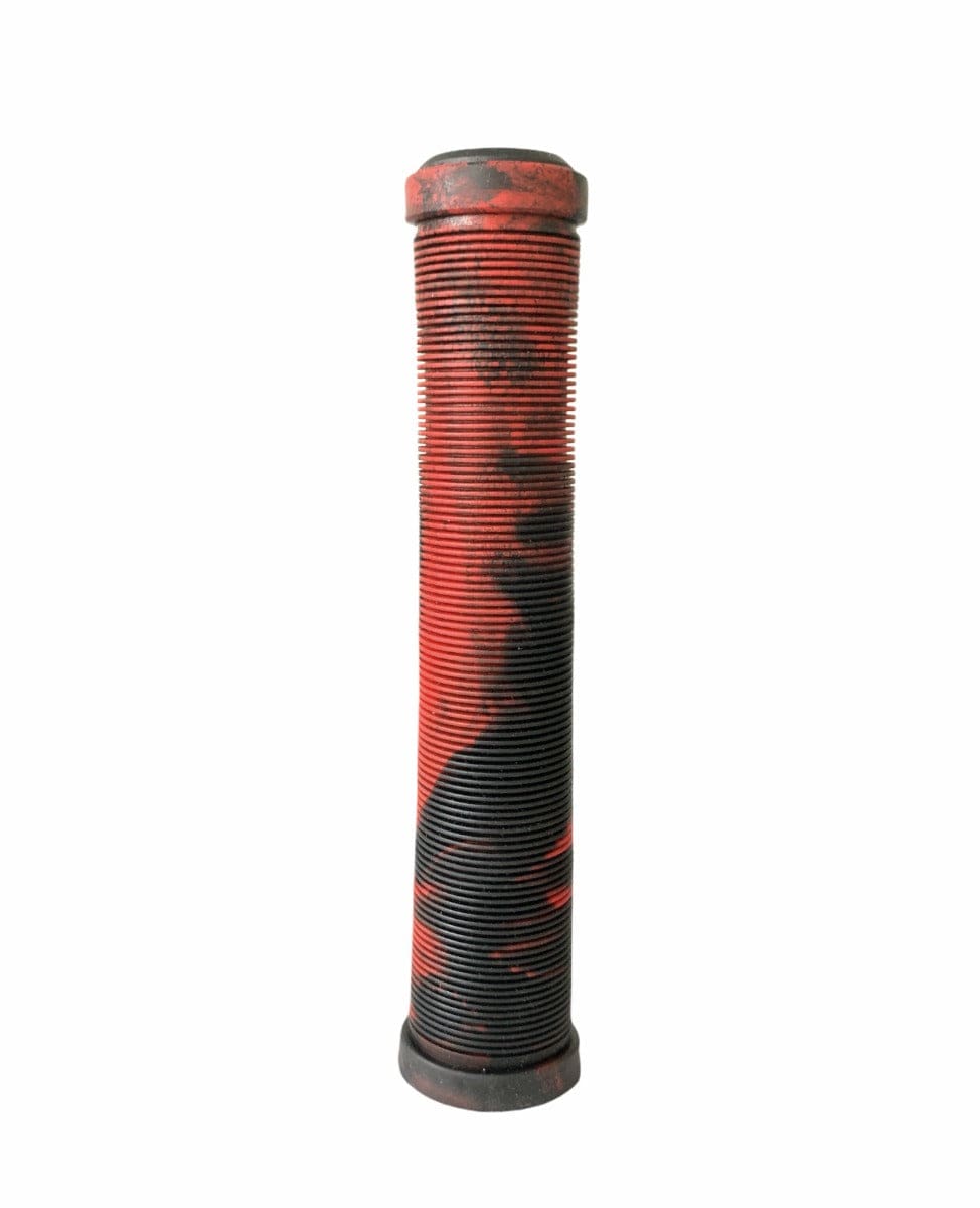 A tall, cylindrical industrial filter stands upright against a white background, resembling well-worn Revolution Fused Black / Red Stunt Scooter Grips. It is heavily covered with black and red residue and exhibits layers of dirt across its surface, yet retains its high-grade TPR durability.