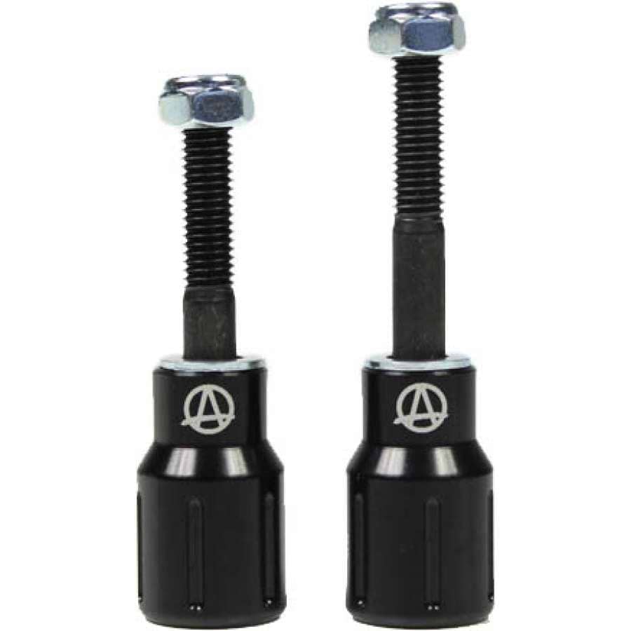 Two black Apex Barnaynay motorcycle bar end sliders with silver bolts on top. The sliders display a logo featuring an "A" inside a circle. They vary in height, one slightly taller than the other, reflecting Kiall Barnes's design precision.