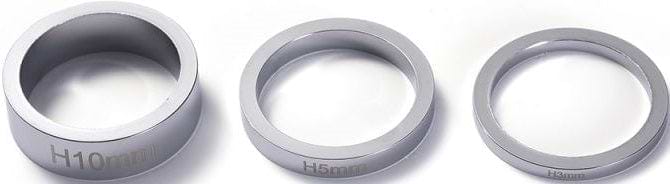 Three chrome rings of different thicknesses are lined up on a white background, resembling headset spacers. Each is labeled with distinct measurements: "H10mm," "H5mm," and "H3mm." These Blunt Envy Scooter Headset Spacers in Chrome are perfect for customizing your Blunt Envy stunt scooter setup.