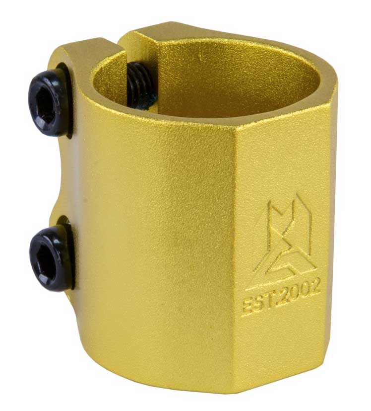 The Madd Gear (MGP) MFX Extreme 2 Bolt Oversized Stunt Scooter Clamp in gold, constructed from 6061 alloy, includes two black screws, a geometric logo, and the text "EST 2002" engraved on the side for unmatched clamping power.