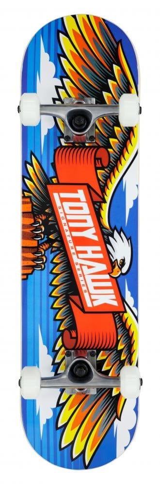 This Tony Hawk 180 Series Wingspan Complete Skateboard - 8" x 31.5" features a vibrant graphic of an eagle with outstretched wings, clutching a red banner with bold white text against a backdrop of blue skies and clouds. The skateboard is complete with white wheels and silver trucks, evoking the iconic design style associated with the Tony Hawk brand.