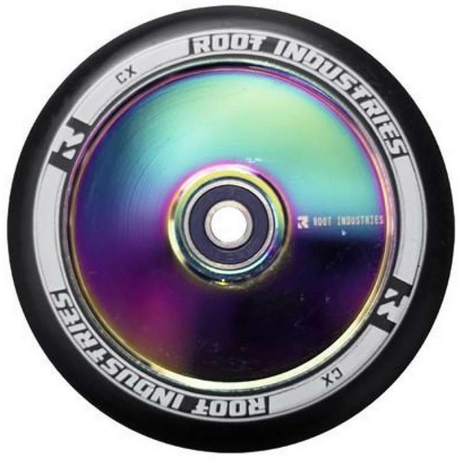 A close-up image shows a Root Industries AIR Hollowcore 120mm stunt scooter wheel, featuring a shiny, neochrome core and a black outer tire. The brand name is elegantly printed around the rim in crisp white text.
