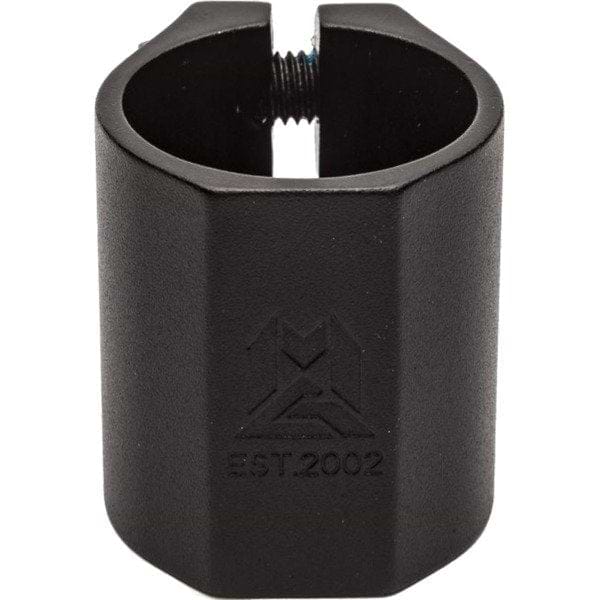 The Madd Gear MGP MFX Extreme 2 Bolt Oversized Stunt Scooter Clamp in black is a robust, cylinder-shaped metal clamp made from 6061 alloy and designed with engraved details on the sides. Featuring a screw at the top, it is renowned for its excellent clamping power, making it perfect for securing or supporting components in various applications.