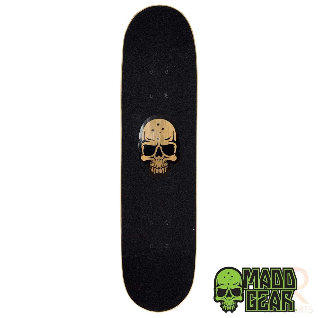This Madd Gear MGP Pro Series Hatter skateboard deck, measuring 8" x 31", includes a black grip tape adorned with a central wooden skull design. Crafted from durable 9-ply maple, it prominently displays the Madd Gear PRO Skateboards logo, featuring a green skull in the bottom right corner.