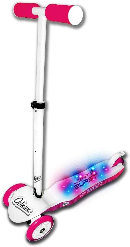 The Ozbozz Light Burst Light Up Kids Tri-Scooter in pink and white boasts a stunning LED light-up deck, perfect for delighting children. The Ozbozz brand name is clearly displayed on this three-wheeled scooter, guaranteeing quality and enjoyment with every ride.