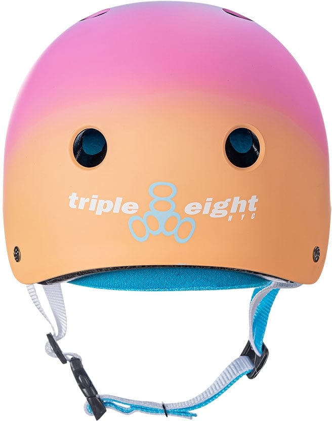 The Triple 8 Certified Sweatsaver Skate Helmet - Sunset boasts a stunning pink-to-orange gradient design, offering dual-certified protection. It features high-impact absorbing EPS foam, two vent holes, and an adjustable chin strap for optimal comfort and safety. The renowned white "triple eight" logo is displayed prominently on the front.