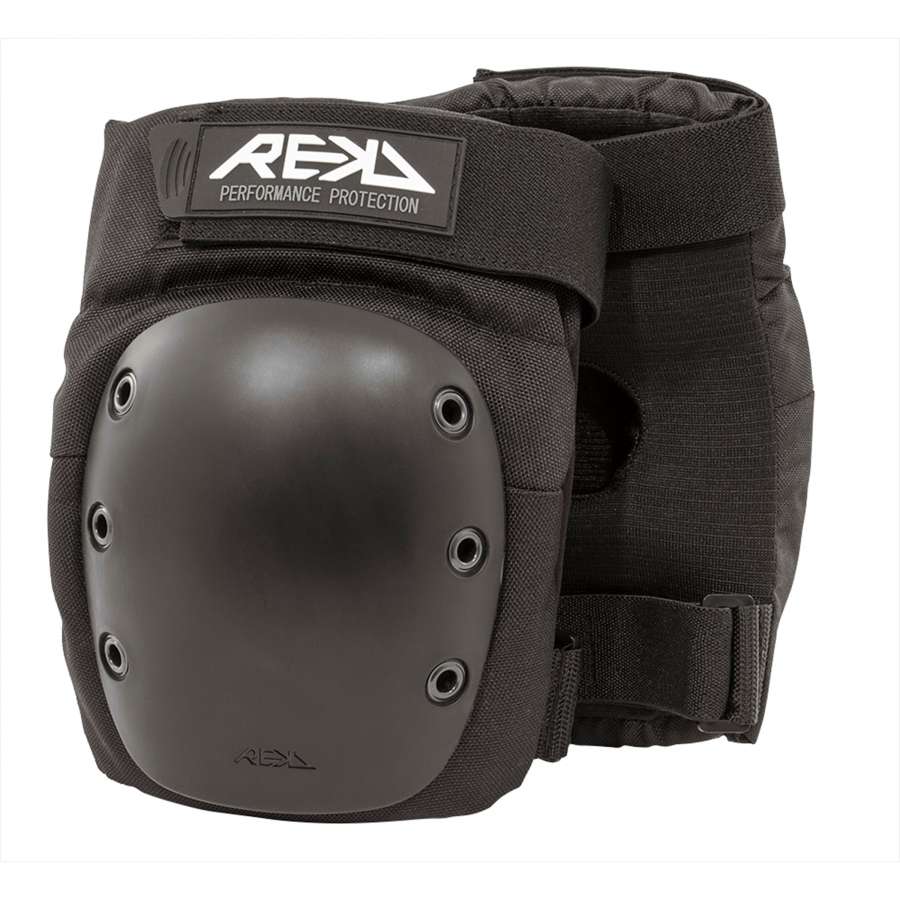 The REKD Ramp Knee Skate Protection Pads in black feature hard plastic caps and adjustable straps. The "REKD Performance Protection" logo is prominently displayed on the upper strap. Designed for action sports, these pads provide excellent impact resistance for optimal knee protection.