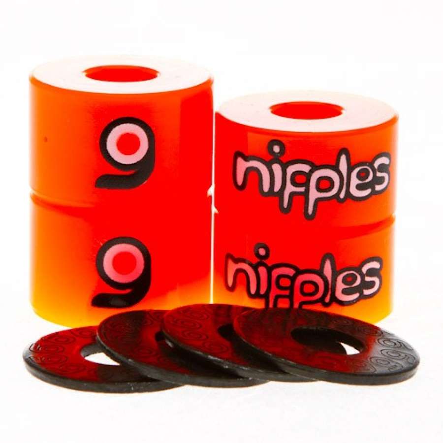 The Orangatang Nipples Orange Longboard Bushings - Soft 85A set features four orange cylindrical bushings made from high rebound urethane, perfect for carving and freestyle. This set includes pairs of bushings stacked alongside four black washers, all presented with a glossy finish against a white background.