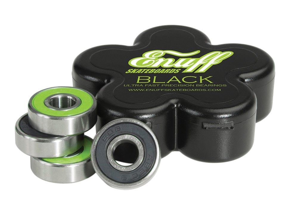 A set of Enuff Black Skateboard Bearings - 8 Pack, featuring green and silver detailing, is displayed next to a black, flower-shaped case labeled "Black Ultra Fast Precision Bearings" by Enuff, ensuring an ultra-smooth ride with unparalleled precision for every skating adventure.