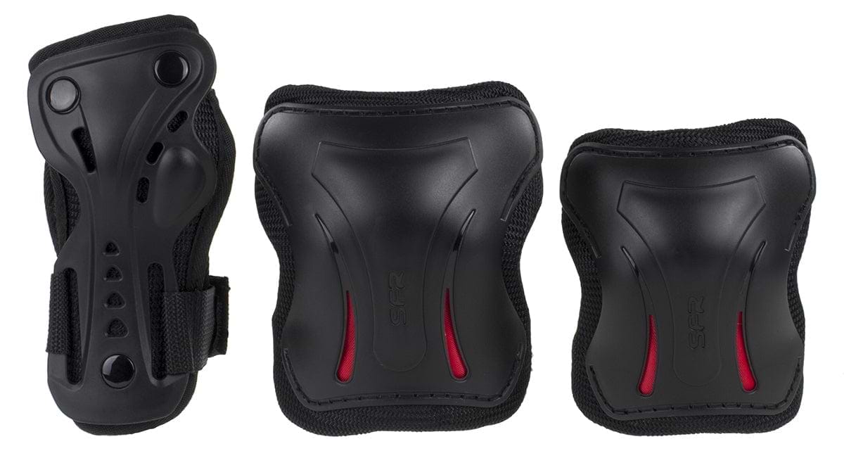 Introducing the SFR Essentials Junior Triple Skate Protection Pad Set - Black: an entry-level protection kit set against a white backdrop. This sleek black gear includes knee pads, elbow pads, and wrist guards with red accents, enhanced with impact caps for added safety. Perfect for young thrill-seekers!