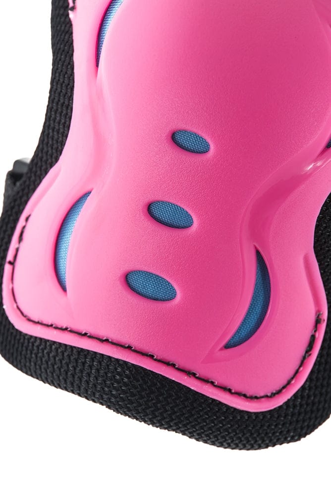 The SFR Essentials Junior Triple Skate Protection Pad Set in Pink/Blue includes a close-up view of the pink and black sports pad, showcasing three small blue ventilation holes. The design highlights smooth curves and textured edges for dependable impact protection.