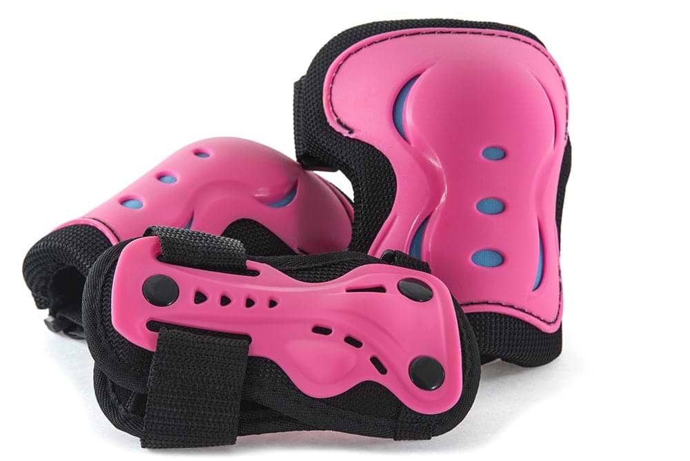 A close-up image highlights the SFR Essentials Junior Triple Skate Protection Pad Set - Pink / Blue by SFR, which includes three pieces of pink protective gear. The set's knee and elbow pads are constructed with hard plastic and black fabric, featuring impact caps for activities such as skating or cycling.