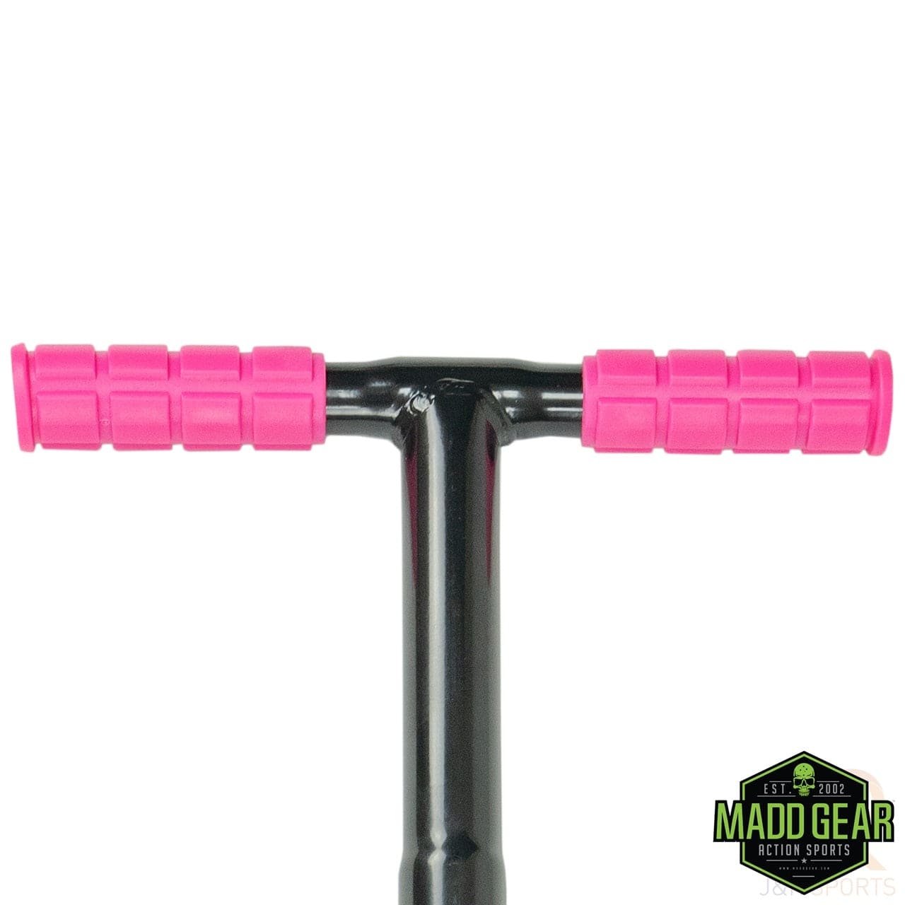 A close-up image features the black handlebar of the Madd Gear MGP Pogo Stick, adorned with bright pink grips. The robust high-grade alloy stem guarantees durability, and the Madd Gear (MGP) logo is prominently displayed in the lower right corner.