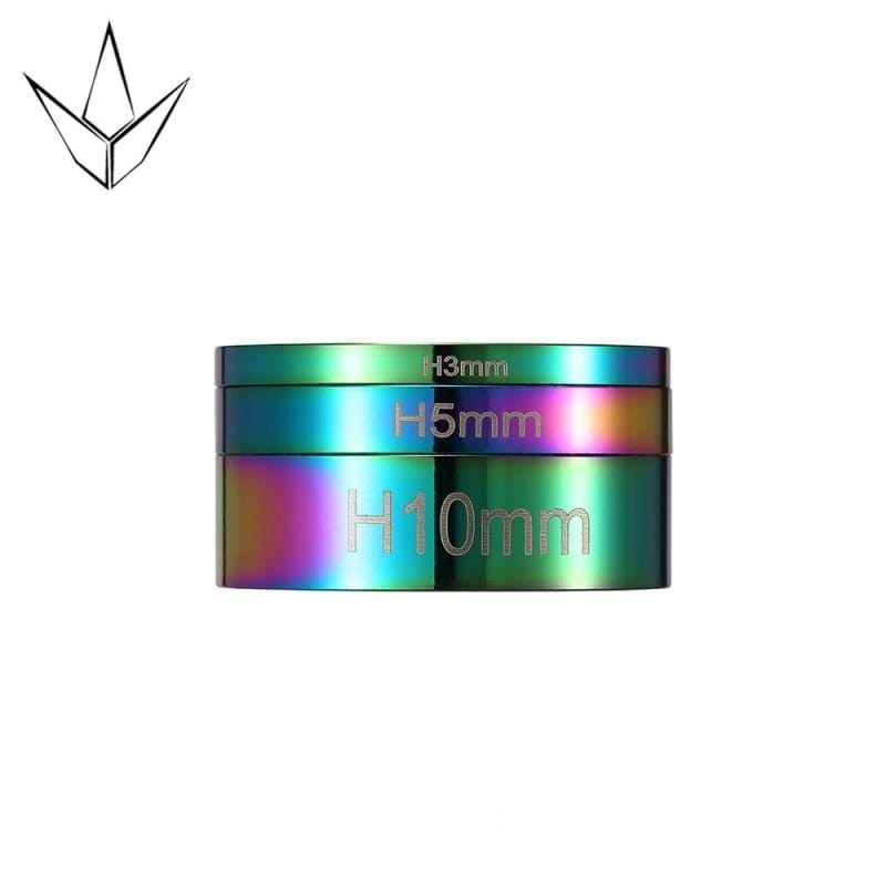 A circular item featuring the Blunt Envy logo, similar to the stylish Oil Slick Neochrome headset spacers designed for a stunt scooter.