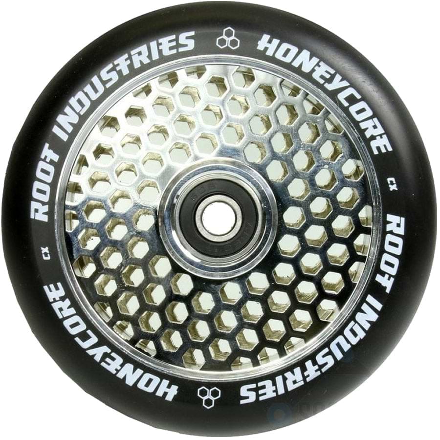 The Root Industries Honeycore 110mm Stunt Scooter Wheel in Black / Mirror Chrome features a unique honeycomb design on its metal core, with "Honeycore" and "Root Industries" printed in white on the outer rubber. This top-tier wheel is equipped with Root Industries' high-quality central bearing for an exceptionally smooth ride.