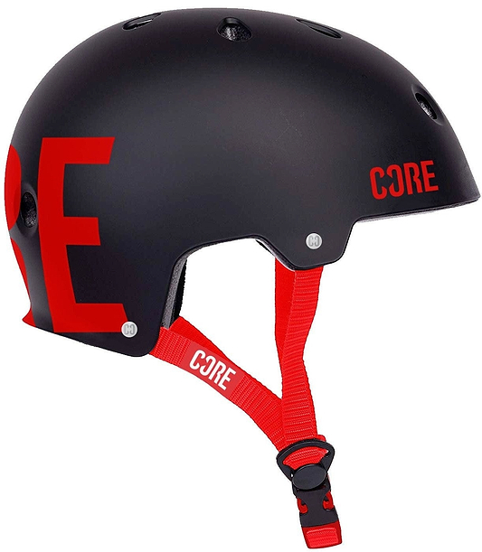 Introducing the CORE Street Skate/Scooter Helmet in Black and Red, showcasing bold "CORE" lettering on the side. This helmet features a classic skate design with ventilation holes, an adjustable red strap, CORE Lux Pads for enhanced comfort, and a quick-release buckle for effortless style.