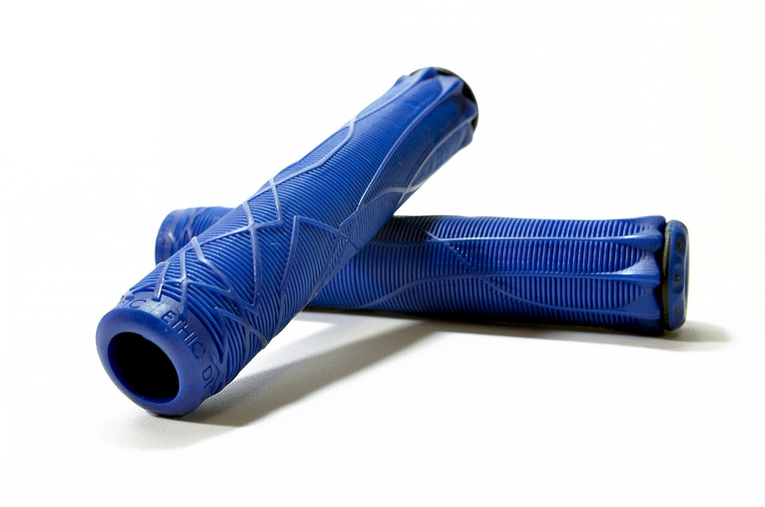 Two Ethic DTC Blue Stunt Scooter Grips, each measuring 170mm and made from durable thermoplastic rubber, are displayed resting one atop the other against a plain white background. Designed for ultimate comfort and control, these grips are perfect for enhancing style and performance on any ride.