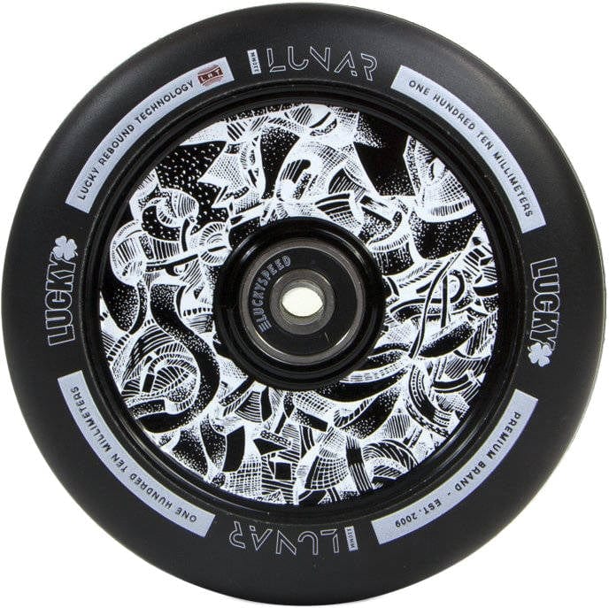 The Lucky Lunar 110mm Stunt Scooter Wheel in Axis Black features complex white abstract designs. The words "Lunar," "Lucky Rebound Technology," and "One Hundred Ten Millimeters" are gracefully printed around the rim, making it an eye-catching component for high-end scooter constructions.