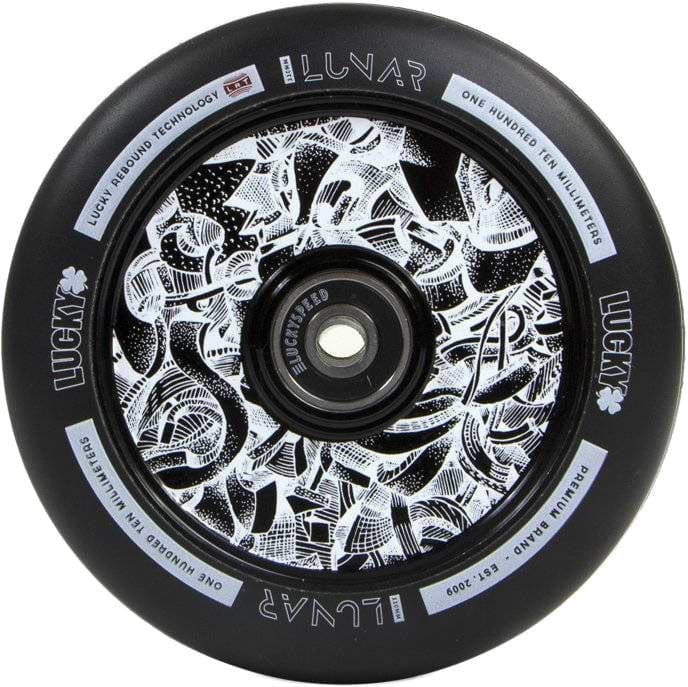 Close-up of a black wheel featuring intricate white abstract patterns on the hub, ideal for scooter builds. The words "Lucky Lunar" and "110 millimeters" are prominent, showcasing the advanced rebound technology of the Lucky Lunar 110mm Stunt Scooter Wheel by Lucky.