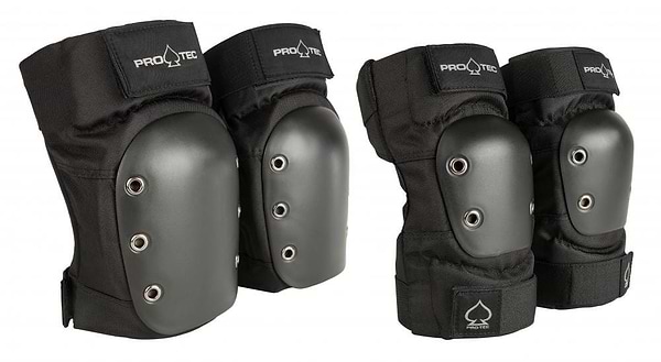 Introducing the Pro-Tec Street Knee / Elbow Skate Protection Pad Set - Black, a high-quality set of protective gear featuring hard shell caps and metal rivets. Ideal for skateboarding and rollerblading, these black pads offer excellent safety for your adventures. The sturdy straps are proudly embellished with the Pro-Tec logo, ensuring both durability and style.