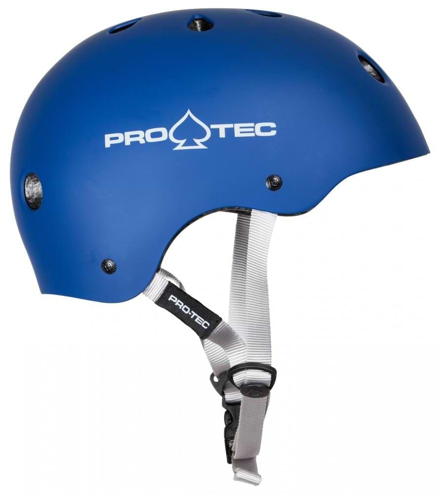 The Pro-Tec Classic Certified Skate/Scooter Helmet in Matt Blue features white straps and ventilation holes, complete with a high-impact absorbing ABS shell. The "PRO-TEC" brand logo is printed in white on the side, making it perfect for extreme sports enthusiasts.