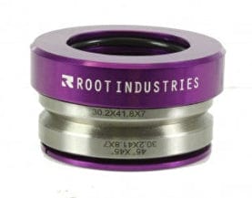 A close-up of the premium Root Industries Integrated Stunt Scooter Headset highlights its sealed bearings, striking purple top ring, and silver components. The vibrant purple ring prominently showcases the Root Industries brand name.