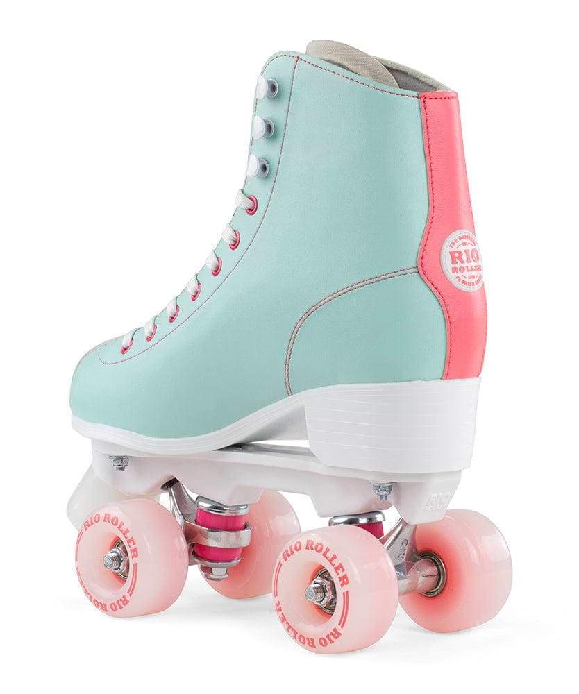 Introducing the Rio Roller Script Quad Roller Skates in Teal and Coral. These skates feature a high-boot design crafted from durable PVC leather, embellished with vivid pink wheels and laces. The stylish white heel adds to their appeal, while the prominent "Rio Roller" logo adorns both the side and wheels, representing both style and quality for your skating adventures.