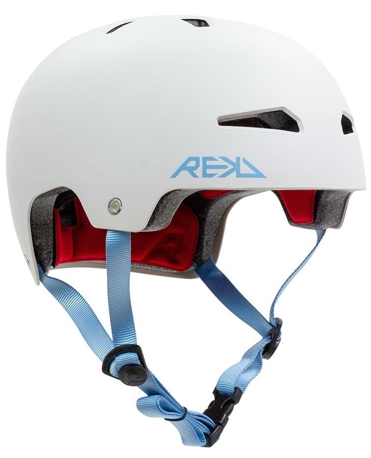 The REKD Elite 2.0 Skate/Scooter Helmet in grey features blue adjustable straps, ventilation holes, and proudly displays the REKD protection logo on the side.