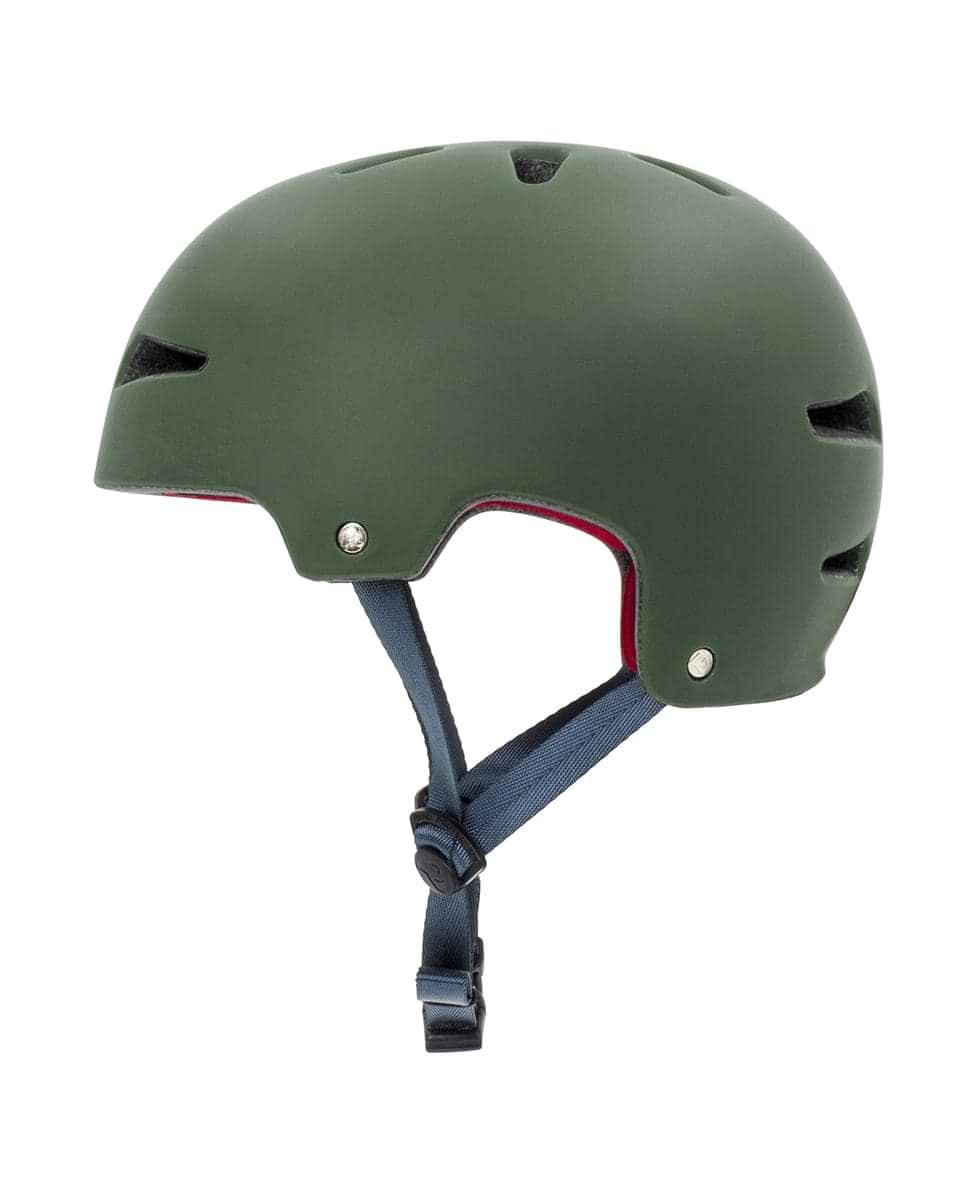The REKD Ultralite In-Mold Skate/Scooter Helmet in green offers a lightweight, matte finish with a smooth surface and a black adjustable chin strap. Engineered for action sports, it incorporates side ventilation holes and boasts a sleek, rounded design to ensure both safety and comfort.