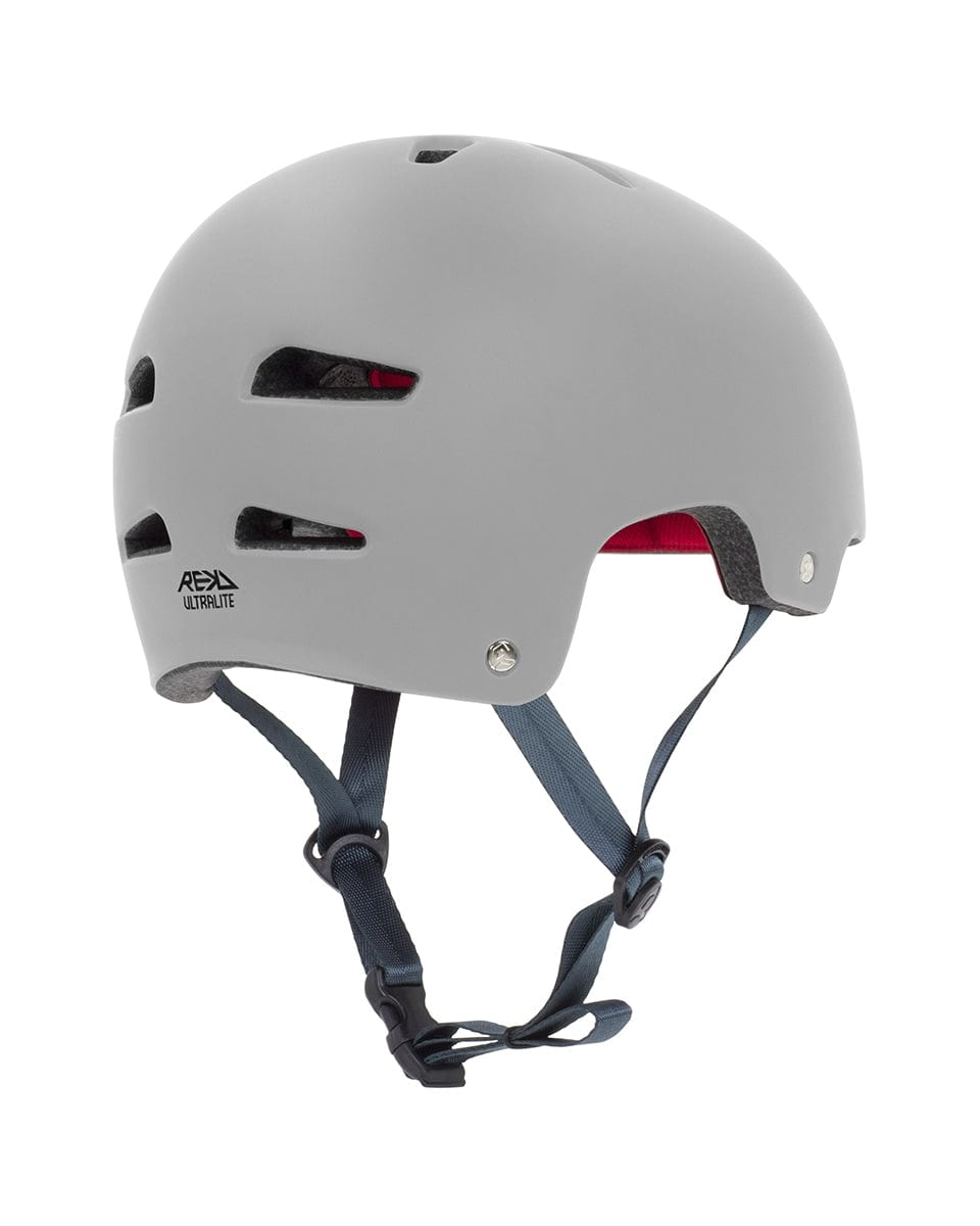 The REKD Ultralite In-Mold Skate / Scooter Helmet in grey, featuring straps and crafted with In-Mold technology, is ideal for action sports enthusiasts.