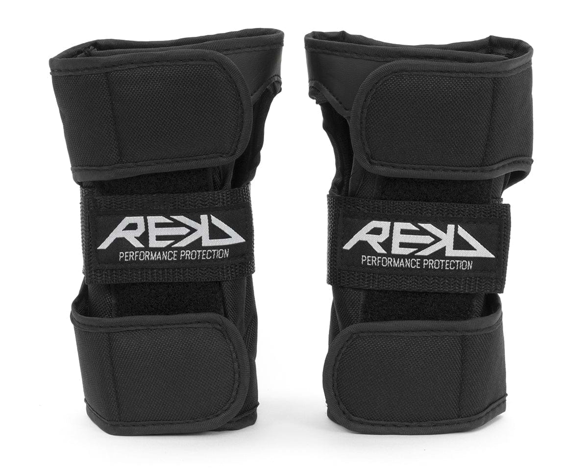 Two black REKD Skate Protection Wrist Guards, adorned with "REKD" on the front straps, are crafted for action sports. They include adjustable velcro straps for a secure fit and offer 360° protection, ensuring both comfort and safety.