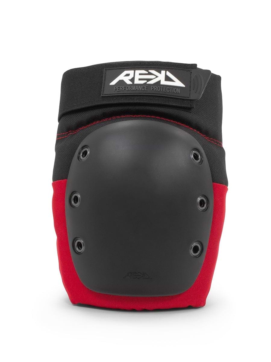 The REKD Ramp Knee Skate Protection Pads in black and red provide strong protection with a hard outer shell and multiple rivets. Designed for skateboarding or rollerblading, these knee pads feature a top strap with the REKD brand logo, ensuring both style and impact resistance.