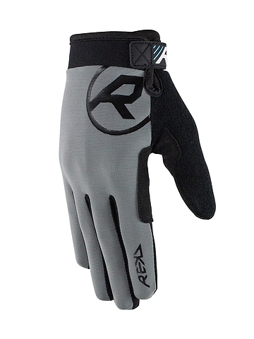 The REKD Status Skate Protection Glove in gray features a large "R" logo on the back and provides an ergonomic fit with an adjustable wrist strap. Its textured palm ensures optimal grip, while its sleek, modern design is touchscreen-friendly, making it a perfect accessory for sports or outdoor activities.
