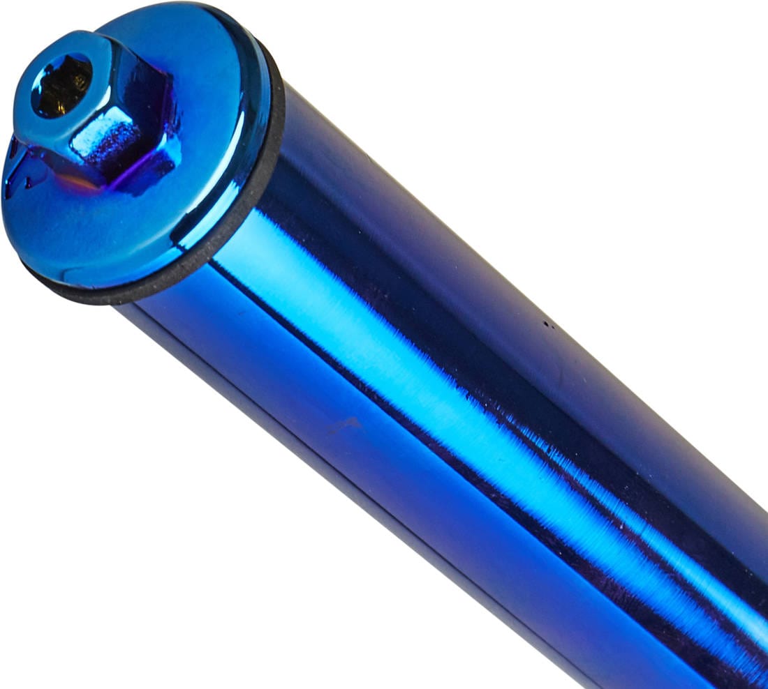 A close-up of a sleek, bluish cylindrical metal object features a hexagonal bolt at its top, reminiscent of the precision-engineered Root Industries AIR SCS/HIC Stunt Scooter Forks in Blu-Ray. Its reflective surface accentuates the lightweight design, set diagonally across the image for an impressive presentation.