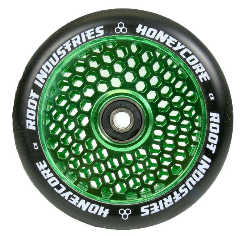The Root Industries Honeycore 110mm Stunt Scooter Wheel in Black/Green boasts a stylish honeycomb cut-out design with a black tire. It features "Root Industries" branding on the edges and is equipped with premium Root bearings for superior performance.