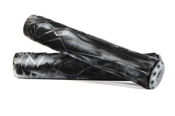 Two Ethic DTC Black/White Stunt Scooter Grips, measuring 170mm each and made from durable thermoplastic rubber, are displayed on a white background. Their textured surfaces include a ribbed pattern and zigzag design, with one grip laid across the other for emphasis.