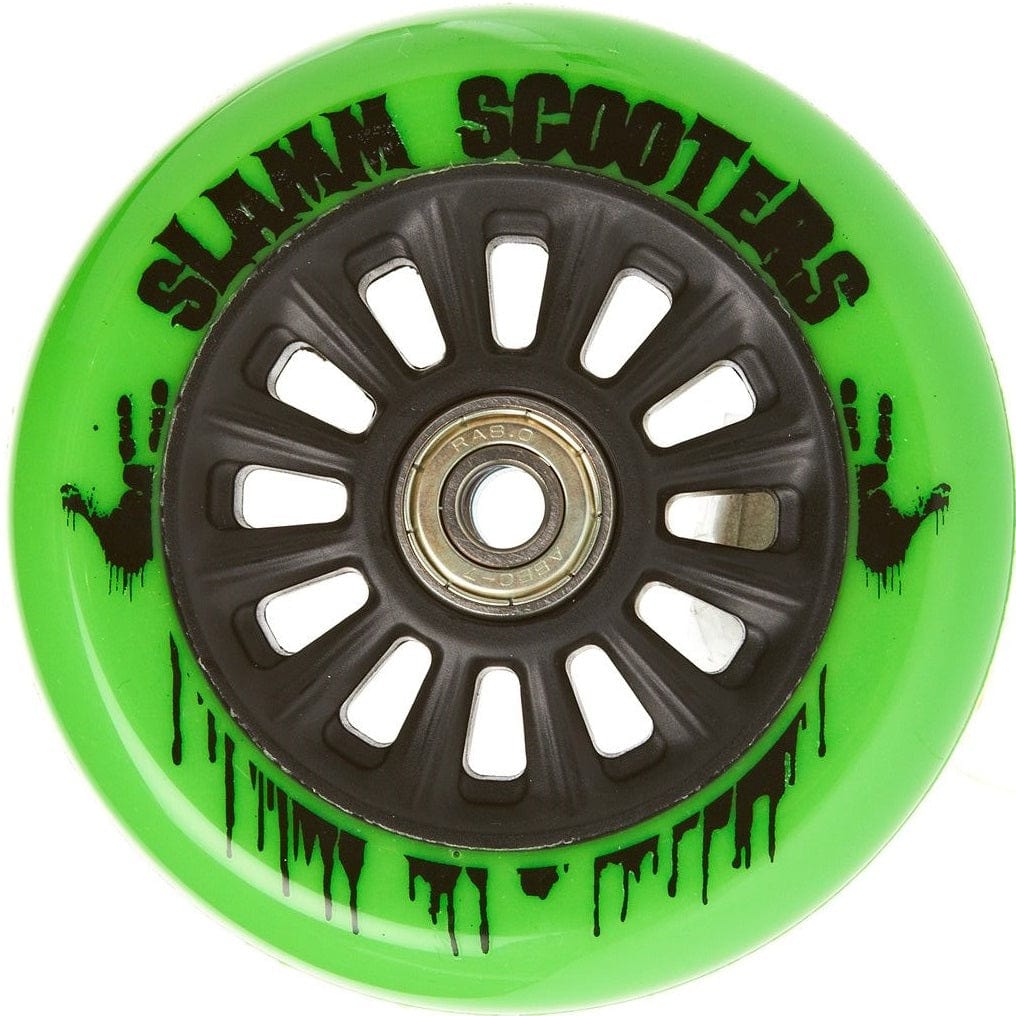 The Slamm Nylon Core 110mm Scooter Wheel in vibrant green boasts black spokes and a central metal bearing, featuring ABEC 9 Chrome Bearings for smooth rides. The edge is adorned with "Slamm Scooters" printed in black, complemented by paint splatters on its polyurethane composite surface.