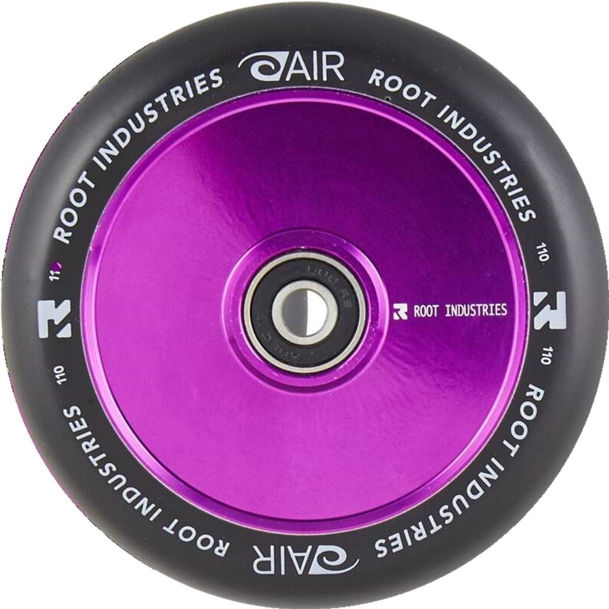 The Root Industries AIR Hollowcore 110mm stunt scooter wheel, in black and purple, showcases a sleek metallic finish with the brand's logo prominently displayed at its center. This wheel features "Root Industries" and "AIR" in white lettering encircling its edge, blending style with high performance.