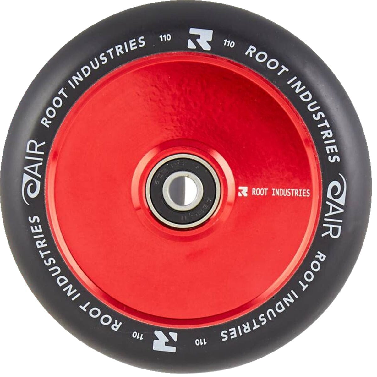 A close-up of the Root Industries AIR Hollowcore 110mm Stunt Scooter Wheel in Black/Red showcases its design. The red core incorporates hollowcore technology with a metal bearing, while the black tire is marked with "Root Industries" and "AIR" in white lettering, highlighting the precision of the AIR Hollowcore design.