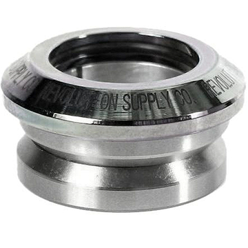 A chrome ring from the Revolution Flow Integrated Stunt Scooter Headset, featuring smooth, polished surfaces and engraved text along the edge. It includes sealed bearings and its cylindrical design indicates its use as a mechanical or industrial component.