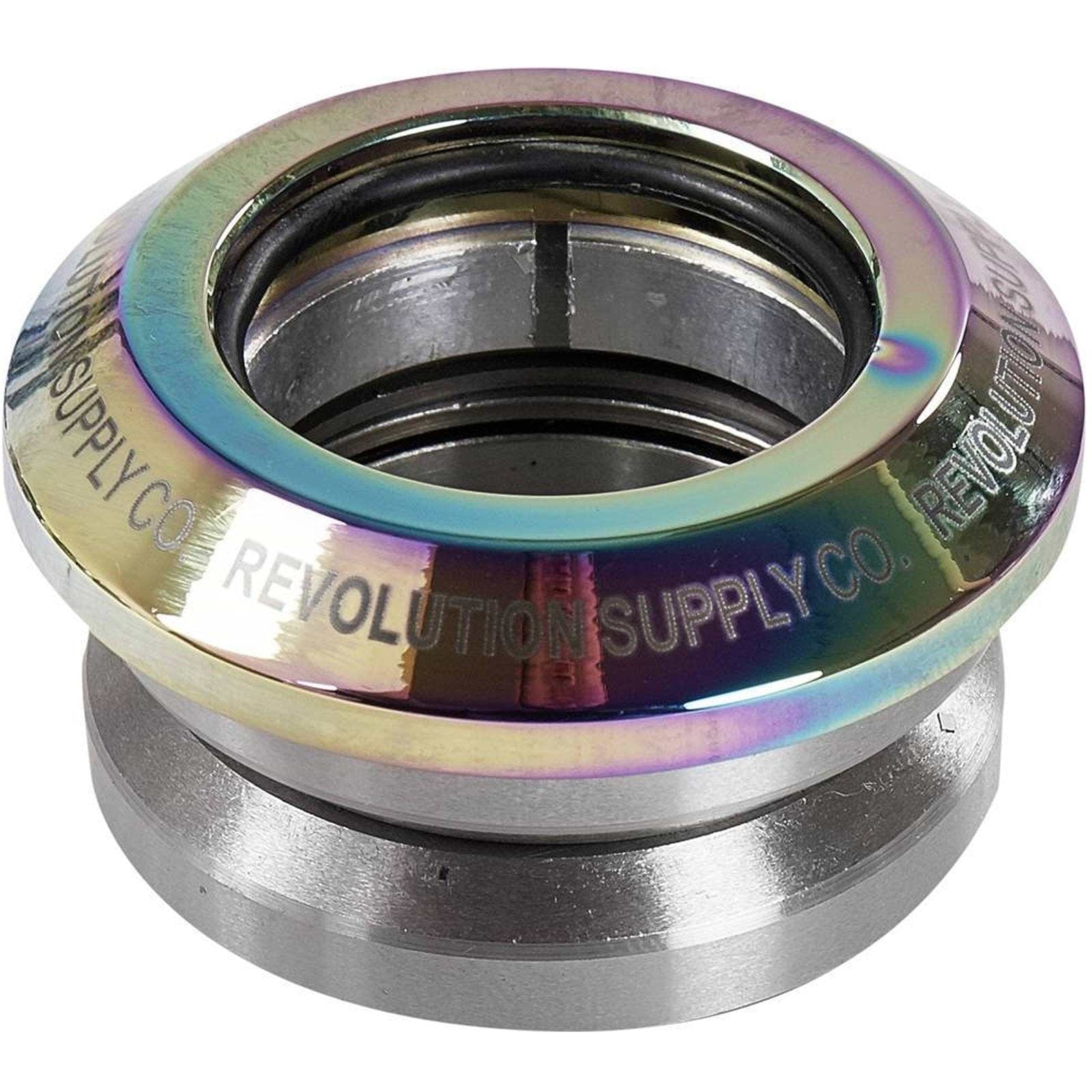 The Revolution Flow Integrated Stunt Scooter Headset in Neochrome, by Revolution, offers a shiny metal design with an iridescent finish and elegantly engraved branding. This model features sealed bearings and meticulously assembled components for smooth performance and durability.