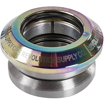 The Revolution Flow Integrated Stunt Scooter Headset in Neochrome, by Revolution, offers a shiny metal design with an iridescent finish and elegantly engraved branding. This model features sealed bearings and meticulously assembled components for smooth performance and durability.