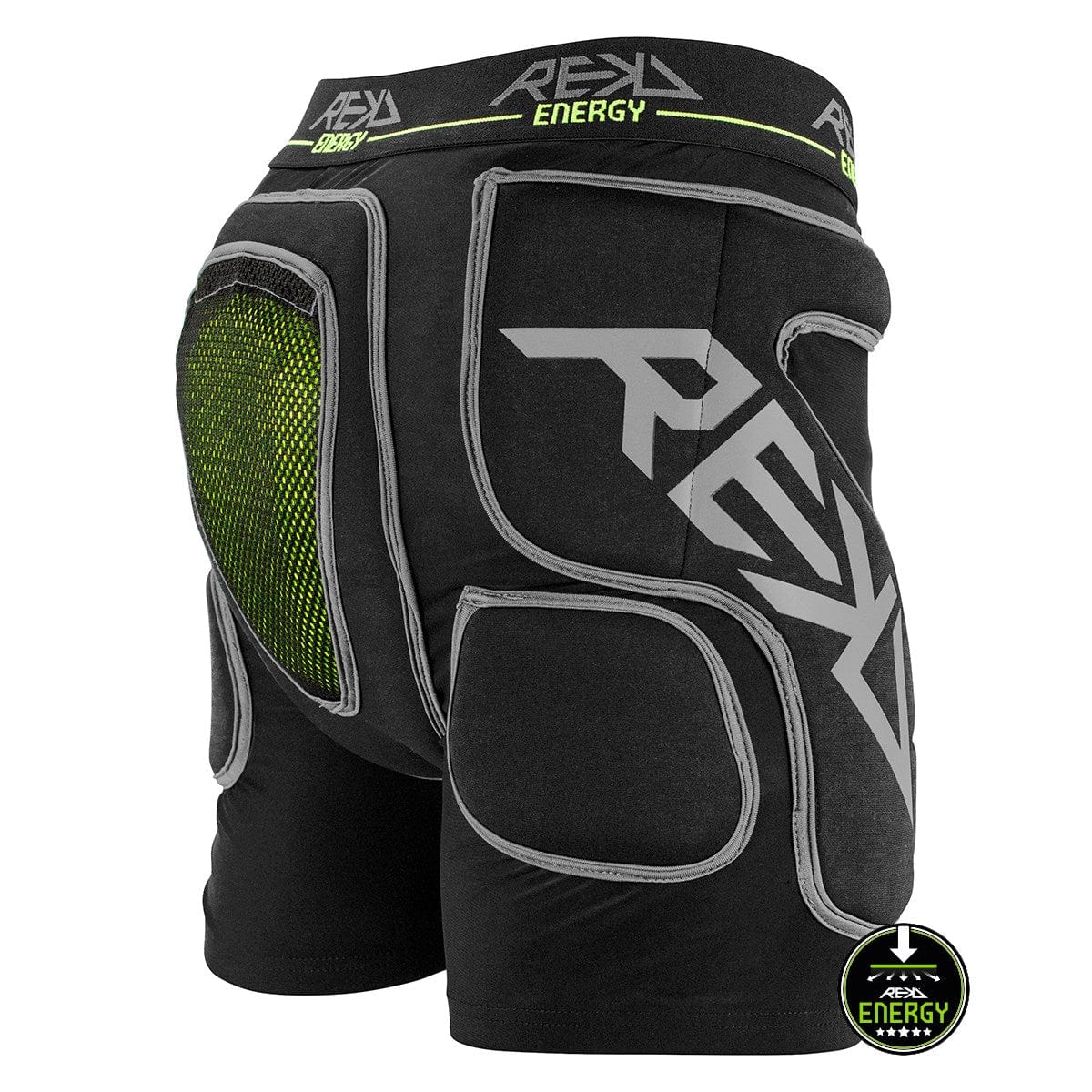 Black REKD Energy Impact Skate Protection Shorts feature gray accents, a green mesh ventilation panel, and a coccyx bone protector. "REKD Energy" branding is prominently displayed on the waistband and leg, while a circular logo at the bottom right corner provides additional product details for these shorts.